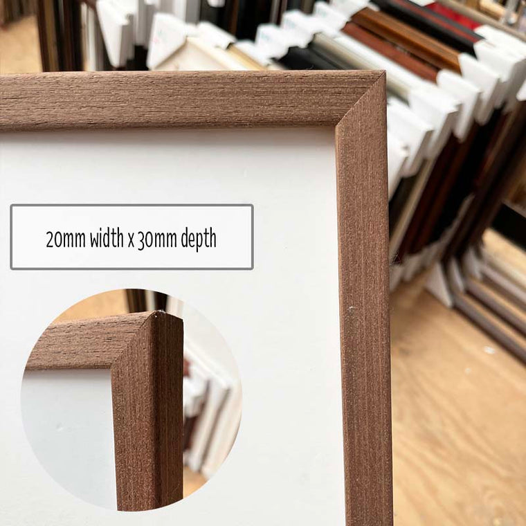 A2 Photo Frame in a Modern Brown Timber finish made from quality custom framing materials. This frame is a one off made from excess stock and includes quality foamboard, Perspex, and Wire Pack for both vertical and horizontal hanging on the wall. This frame is suited to an A2 (42cm x 59.4cm) Photo or artwork, or you can add a matboard insert to fit a smaller A3, 11"x14", A4 or 8"x10" Photo or Artwork