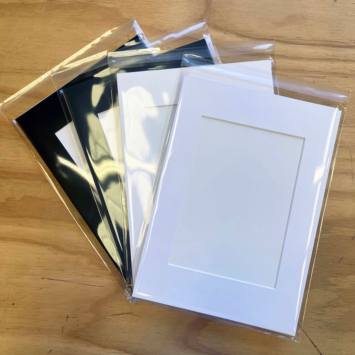 Photo Frame Matboard Insert in your choice of Bright White, Off White, Black or Charcoal Grey. Available to fit in frame size A1, A2, A3, 50x70cm or 16"x20" and window cut to suit your size artwork.