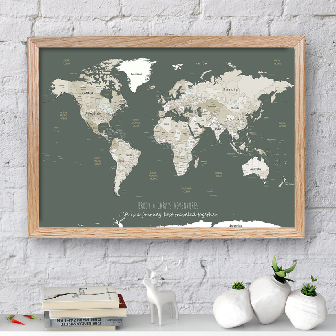 Personalised World Map Framed Pin Board Sage Green and Whites. Our World Map Pin Boards make for a great Housewarming Gift, Gift for Her, or Travel gift.  Personalised Map includes inspirational travel quote and family details.